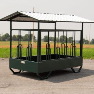 Green metal covered livestock hay feeder